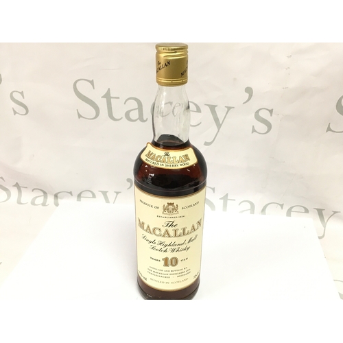 852 - A vintage bottle of Macallan 10 year old whisky 75cl. Sealed with good level.
