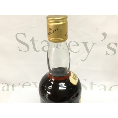 852 - A vintage bottle of Macallan 10 year old whisky 75cl. Sealed with good level.