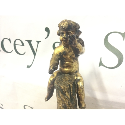 853 - A gilt mounted putti on a marble base, 28cm tall