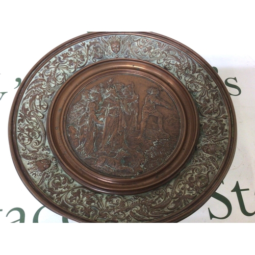 868 - A Victorian Art Union Copper Tazza the centre with raised relief figures the outer edge with scroll ... 