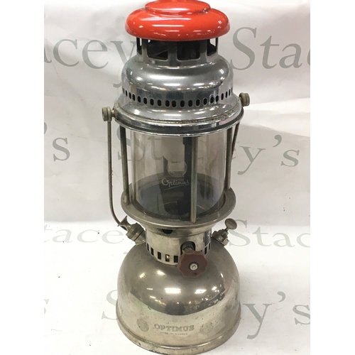 870 - A vintage Swedish Optimus chrome kerosene lamp with a red top. 42cm tall NO RESERVE