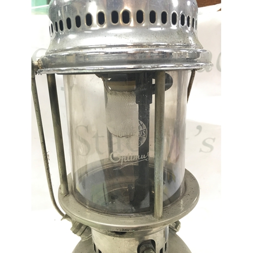 870 - A vintage Swedish Optimus chrome kerosene lamp with a red top. 42cm tall NO RESERVE