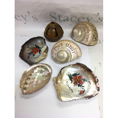 871 - Five mother of pearl shells and a carved seed pod (6). NO RESERVE