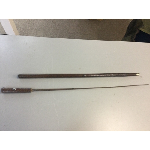 876 - A sword stick. 87cm total length . Blade 68cm long .