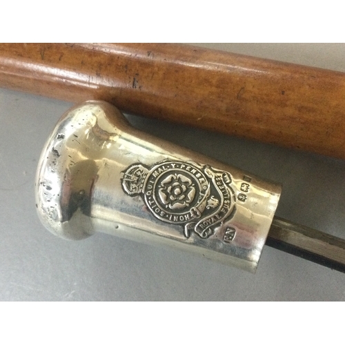878 - A sword stick with a Royal Fusiliers silver hallmarked top. Blade 39cm long. 90cm total length