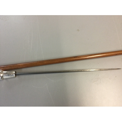 878 - A sword stick with a Royal Fusiliers silver hallmarked top. Blade 39cm long. 90cm total length
