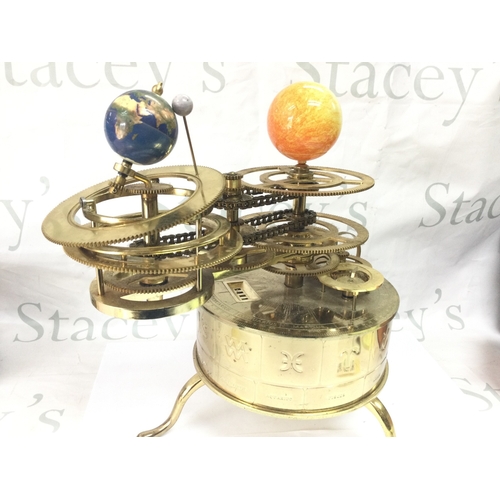 883 - An Eaglemoss sun/moon/earth orbiter electric clock tellurium. 34cm tall
