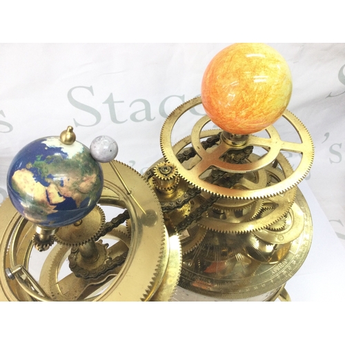 883 - An Eaglemoss sun/moon/earth orbiter electric clock tellurium. 34cm tall