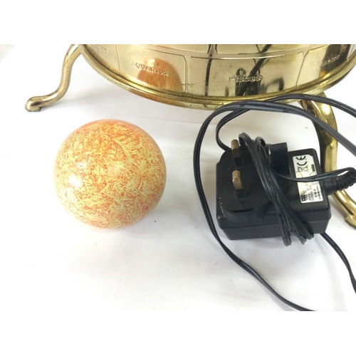 883 - An Eaglemoss sun/moon/earth orbiter electric clock tellurium. 34cm tall