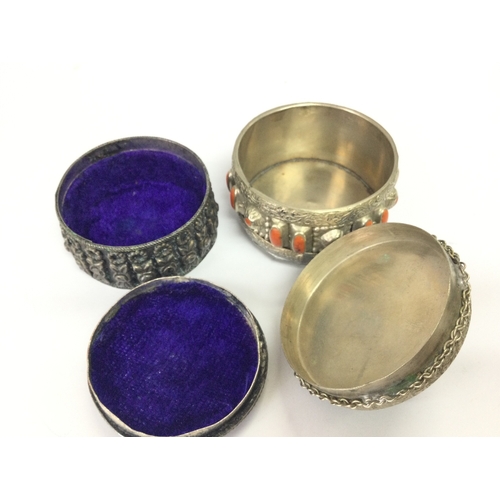 893 - Two nickel silver or alpaca silver 800 snuff/ perfume / trinket boxes. 65mm high box with green ston... 