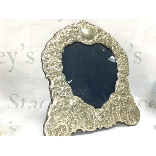 894 - A hallmarked heart shaped silver photograph frame by Carr of Sheffield 1990s Height 28cm width 25cm