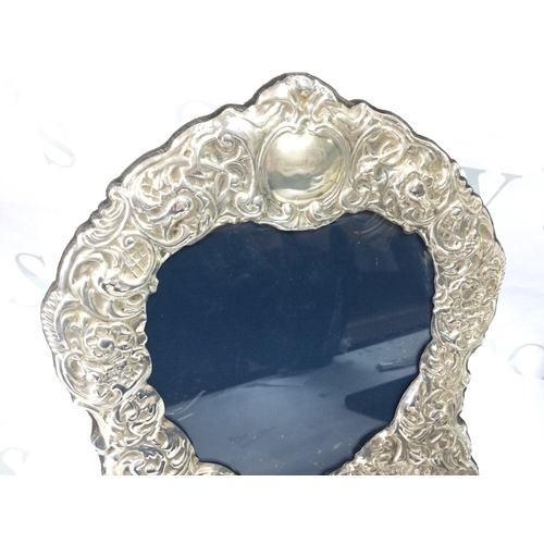894 - A hallmarked heart shaped silver photograph frame by Carr of Sheffield 1990s Height 28cm width 25cm