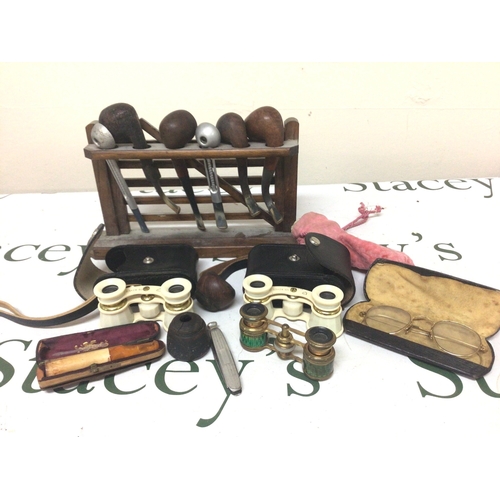 898 - A collection of vintage pipes in a rack three pairs of opera glasses yellow metal rimed vintage spec... 