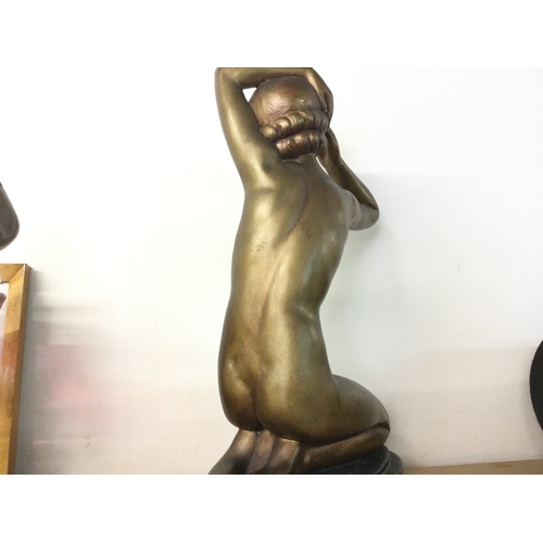 901 - An Art Deco bronze effect plaster figure of a nude lady