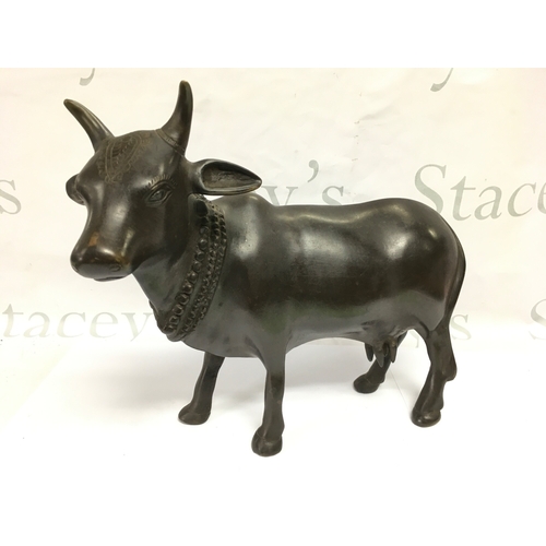 905 - A 20th Century Indian model of a cow, approx height 29cm.