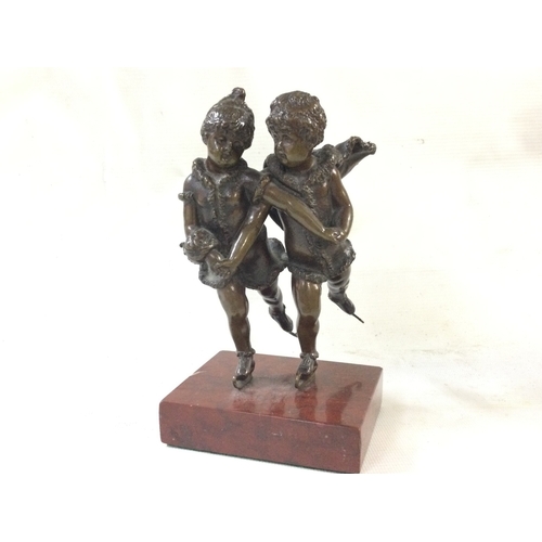 907 - A small bronze early 20th century skating figure on a marble base. 17cm tall