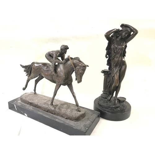 909 - Two bronze figures including Aphrodite goddess figure and racehorse figure. 24 and 30cm tall