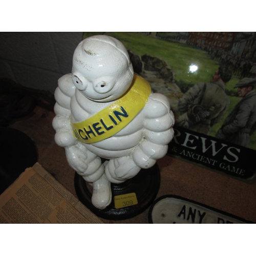 309 - Cast iron advertising Michelin Man on stand