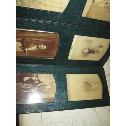 24 - Early 20th century family photographs in green leather fold out album