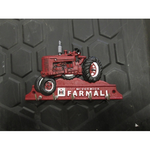 18 - Cast iron advertising Farmall key rack