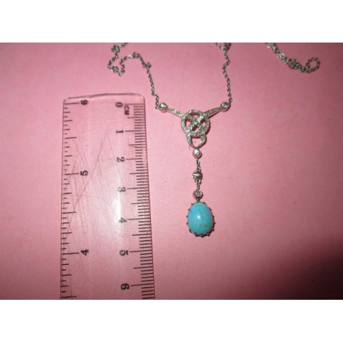 103 - Very pretty unmarked white gold Art Deco style pendant  set with graduated diamonds with a turquoise... 