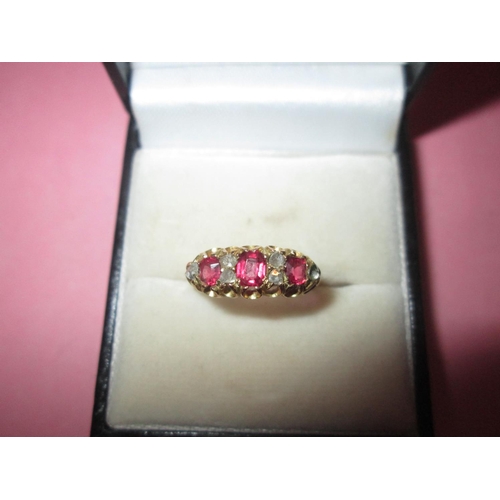 106 - 15 ct gold ring set with six diamonds and three graduated rubies size N (53) 2.4 g