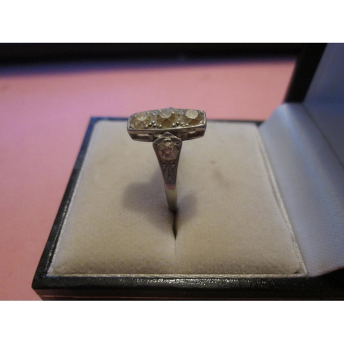 108 - Exquisite unmarked white gold art deco ring with three diamonds and further diamonds down the shank ... 