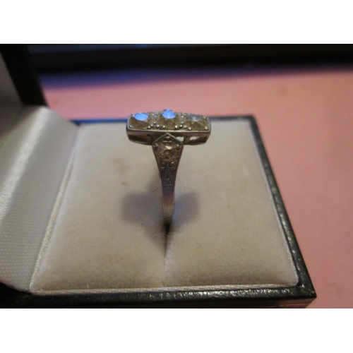 108 - Exquisite unmarked white gold art deco ring with three diamonds and further diamonds down the shank ... 