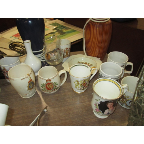 198 - Box of commemorative ware, heavy glass vase, cast iron bookends, galvanised bucket