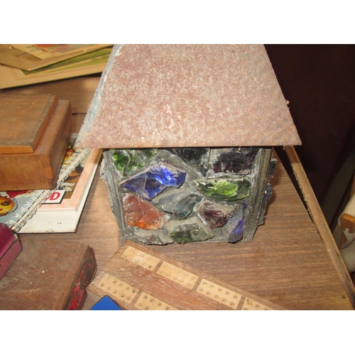 203 - Box of oddments : Sorrento ware musical box, slag glass lamp, Ronson lighter etc.