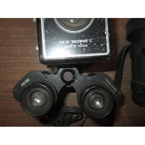 209 - Pair of Ppinz binoculars, Opticron 10 x42, telephoto lens convertor, Brownie C camera