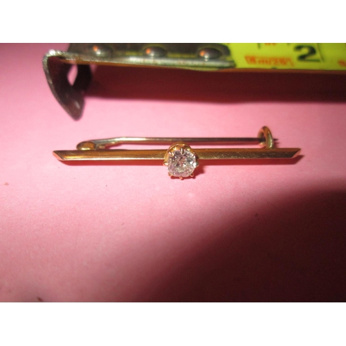 111 - 18ct gold bar brooch set with good sized diamond 1.7 g