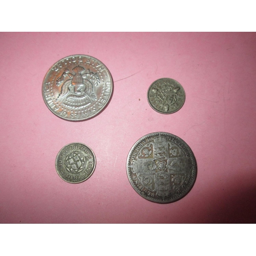 115 - 2 x silver threepence 1931  & 1939, both tarnish & polished Florin 1849, 1974 Liberty Dollar