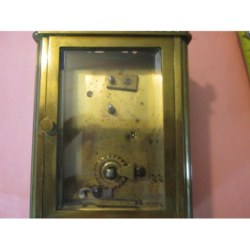 125 - Early 20th century carriage clock with painted and gilded dial