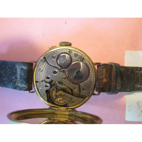 127 - Gents wristwatch from the early 1920's in 9 ct gold case with painted face and subsidiary second dia... 