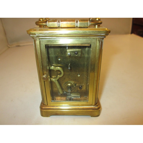 280 - Late 19th / early 20th century carriage clock with painted dial, bevelled glass and gilded brass cas... 