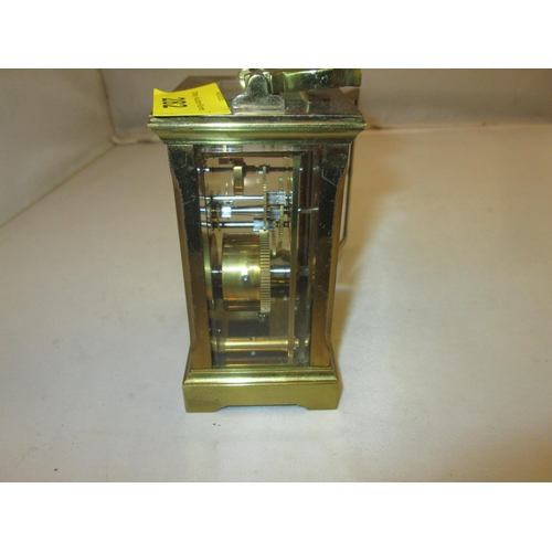 282 - Late 19th / early 20th century carriage clock with painted dial, bevelled glass and gilded brass cas... 