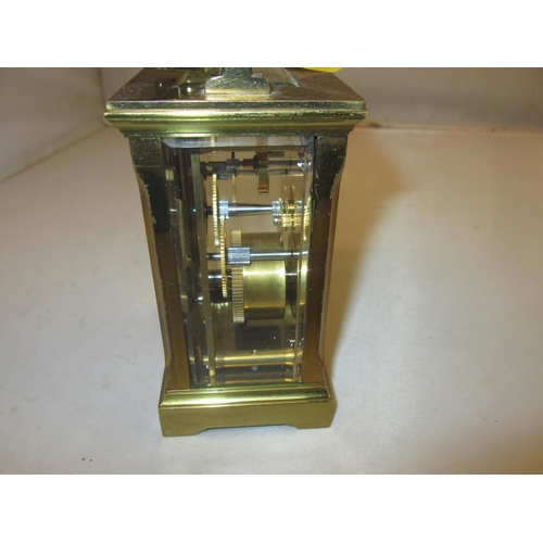 282 - Late 19th / early 20th century carriage clock with painted dial, bevelled glass and gilded brass cas... 