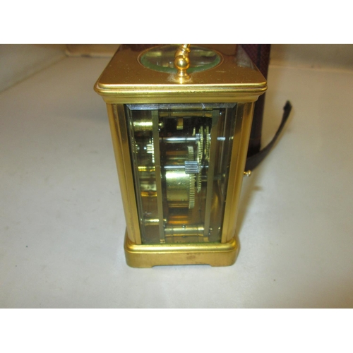 283 - Late 19th carriage clock with painted dial, bevelled glass and gilded brass case with key, in fitted... 