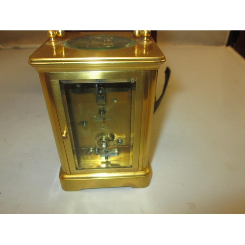 283 - Late 19th carriage clock with painted dial, bevelled glass and gilded brass case with key, in fitted... 