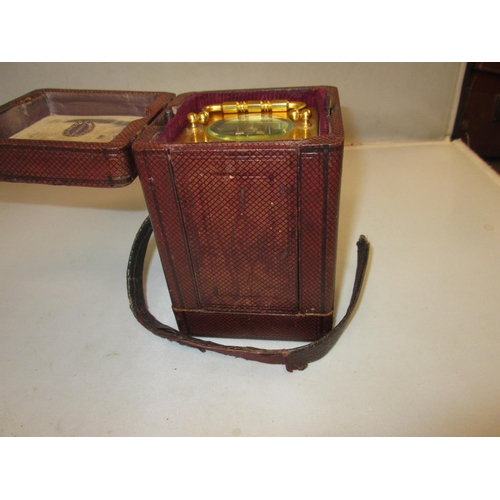 283 - Late 19th carriage clock with painted dial, bevelled glass and gilded brass case with key, in fitted... 