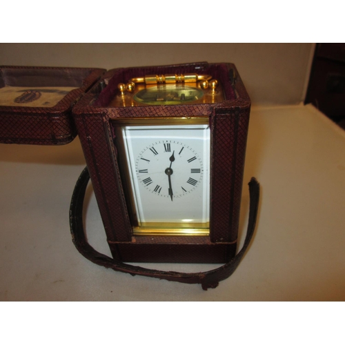 283 - Late 19th carriage clock with painted dial, bevelled glass and gilded brass case with key, in fitted... 