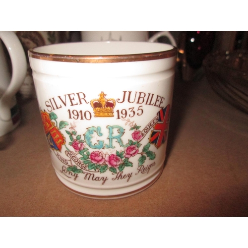 328 - Commemorative ware : Queen Elizabeth II mugs, George V silver jubilee