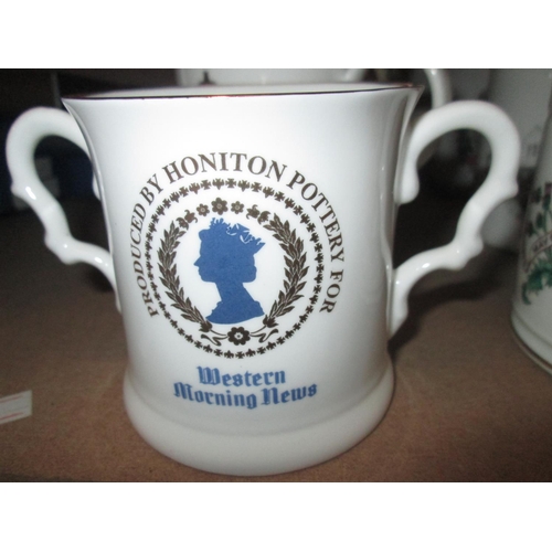 328 - Commemorative ware : Queen Elizabeth II mugs, George V silver jubilee