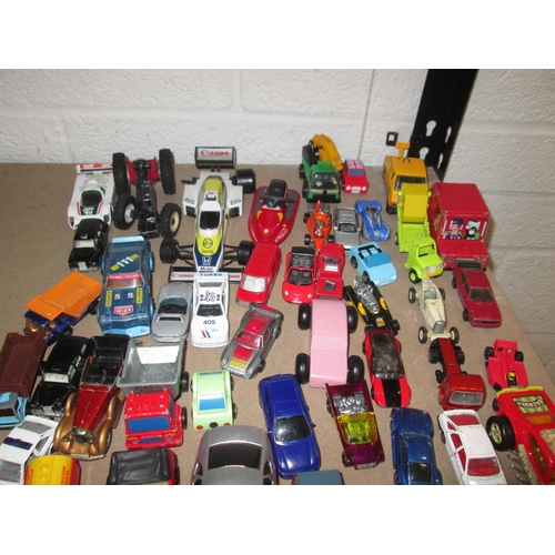 484 - Shelf of play worn condition die cast and other toy cars : Corgi, Burago and other makers included