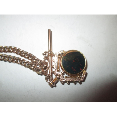 543 - 9 ct gold watch chain with spinning hardstone fob 22 g