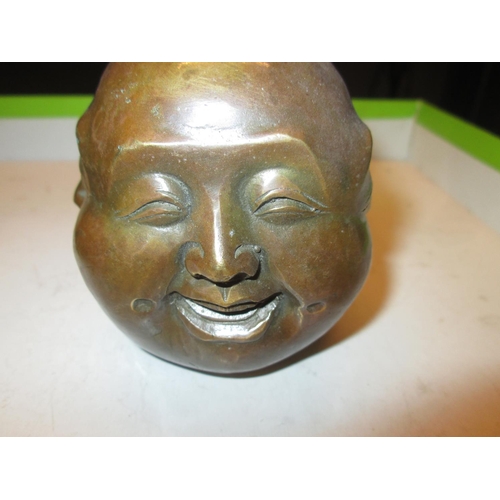 564 - Four Face Chinese paperweight in bronzed metal