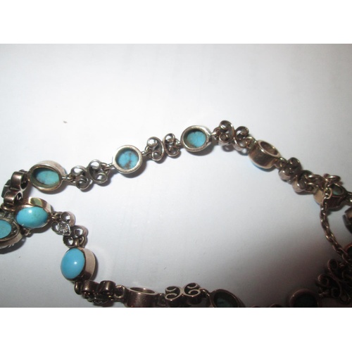 99 - A pretty but unmarked 9 ct gold open link bracelet set with turquoise and diamonds and a heart shape... 