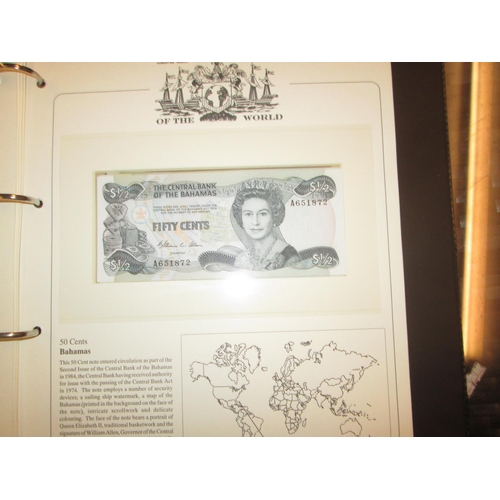 410 - Album of 11 various mixed denomination banknotes from around the world presented in a SG collectors ... 