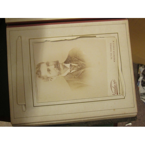 32 - Over 30 early 20th century carte de visites, in an array of formats in an leather and velvet bound a... 